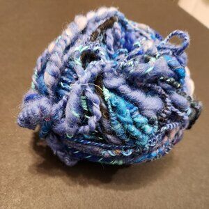 Handmade art yarn, 1.6oz, super fine wool, in shades of blue.